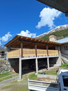 a house being constructed with a wooden roof at Guest House Gvidani In Lakhiri in Mestia