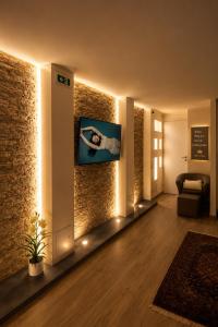 a living room with a wall with lights at Spa & Relax in Cairo Montenotte