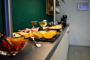 a buffet line with many different types of food at Hotel Schumacher Düsseldorf in Düsseldorf
