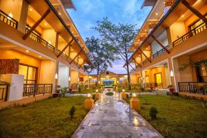 an empty courtyard of a building with lights on it at Royal Jungle Villas in Sauraha
