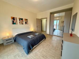 a bedroom with a large bed in a room at SNG - Paggi 78 in Vercelli