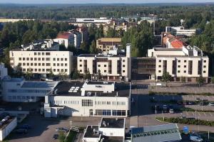 an aerial view of a city with white buildings at Hotel Oscar in Varkaus