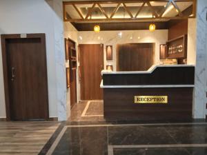 a lobby with a reception desk in a building at S&J Hotel & Banquet in Bhabua