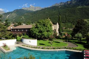 an aerial view of a house with a swimming pool at Ansitz Pünthof in Lagundo