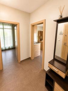 a living room with a mirror and a bathroom at Maxi 2 parking included in Sofia