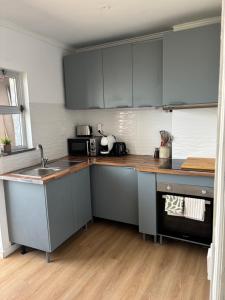 a kitchen with a sink and a counter top at Casa Borges in Quelfes
