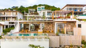 an aerial view of a house with a swimming pool at Villa Bodhi in Ko Phangan