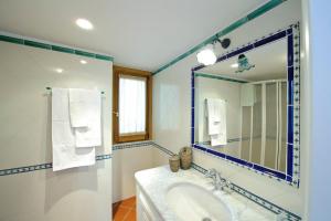 a bathroom with a sink and a mirror at Casa Elena in Praiano +18 photos
