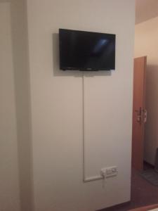 Un televizor și/sau centru de divertisment la Hotel Anna