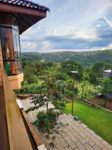 a view of a garden from a house at Highland Park Mondulkiri in Phumĭ Pu Klé (2)