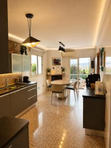 a kitchen with a table and a dining room at Villa Filipinas ,CITY CENTER -ETV10310 in Palma de Mallorca