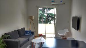 a living room with a couch and a table at Apartamento Las Heras in Buenos Aires