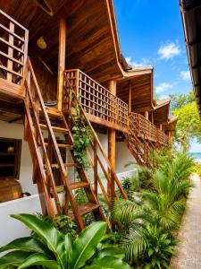 a wooden staircase leading up to a house at Beach Wave Hotel in Arugam Bay