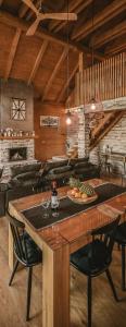 a kitchen with a large wooden table with chairs at Casa Kapusta, Hidden gem in nature, Swimming poll, Jacuzzi, Fire Pit in Ogulin