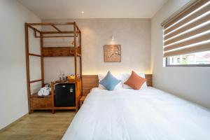 a bedroom with a bed and a bunk bed at MIRO Homestay in Hue