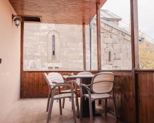 a group of chairs and a table on a balcony at Bethlehem Terrace in Tbilisi City