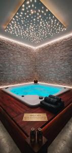 a jacuzzi tub in a room with lights at Spa & Relax in Cairo Montenotte