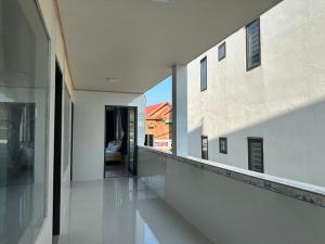 an empty hallway with a view of a building at Motel Mỹ Linh 976 in Long Hai