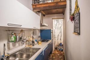 a kitchen with a sink and a counter top at Spacious 2BR with 2 Ensuite Baths in Florence in Florence
