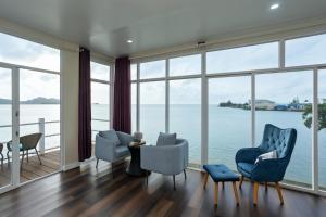 a living room with a view of the water at Seaward in Koror