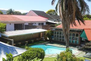 an aerial view of a house with a swimming pool at Asali Lodge in East London