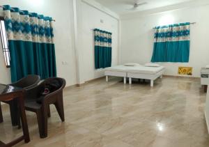 a living room with a couch and a chair at Nature Homestay in Varanasi