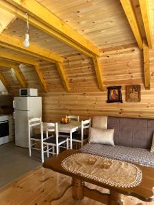 a living room with a couch and a table at Apartman Boro in Žabljak
