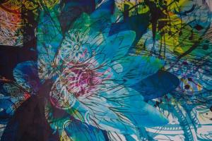 a painting of a flower on a wall at The Pearl in Vitry-sur-Seine