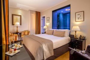 a hotel room with a bed with a large window at Hotel Monte Cenci in Rome