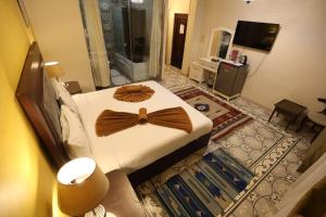 โทรทัศน์และ/หรือระบบความบันเทิงของ Eileen Hotel Cairo