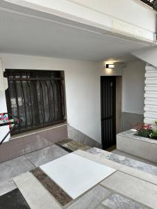 an empty room with a door and a window at AirbnbTzo in Perístasis