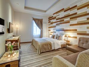 Postel nebo postele na pokoji v ubytování Garni Hotel Zavicaj