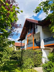 a building with a fence in front of it at Staufen Blick in Piding
