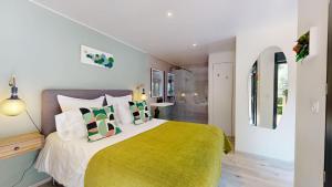 a bedroom with a large bed with a yellow blanket at Casa Dina in Sommières +77 photos