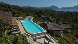 an aerial view of a house with a swimming pool at Atalaya Resort El Nido in El Nido