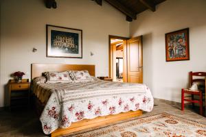 a bedroom with a large bed in a room at The Englishman's Villa Evia in Perivólia