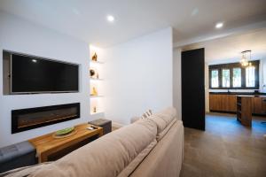 a living room with a couch and a flat screen tv at Luis Montoto in Seville