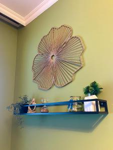 a shelf with a large fan on the wall at Sunset Yavorov Pomorie in Pomorie