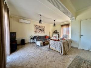 a living room with a couch and a table at Elia in Marathon