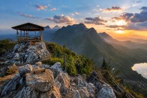 a building on the top of a mountain at Vinla Guesthouse & Backpackers Hostel in Nongkhiaw