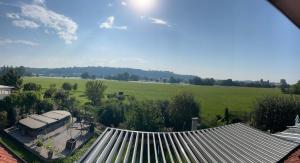 an overhead view of a house with a roof and a field at An der Elbaue in Pirna
