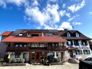 a house with solar panels on the roof at Ferienhof Buschle in Bermatingen