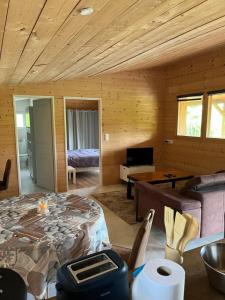 a room with a room with a bed and a desk at Chalet in Fleury-sur-Loire