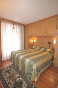 Postel nebo postele na pokoji v ubytování Hotel Sport