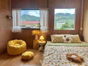 a bedroom with two beds with stuffed animals on them at LYNH HOUSE - Đồng Văn in Dồng Văn