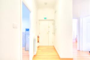 two views of a hallway in a house at La casetta al mercato in Civitavecchia