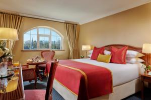 a hotel room with a bed and a table at Killarney Avenue in Killarney