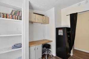 a kitchen with a black refrigerator in a room at Tehachapi 12-Guest Group Escape home in Tehachapi