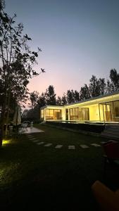 a building with a lot of windows in a park at Encore by Serenity in Hampāpura