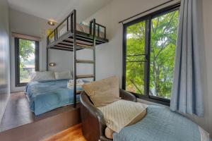 a bedroom with a bunk bed and a couch and a chair at Na Na Doo Homestay in Chiang Rai +176 photos